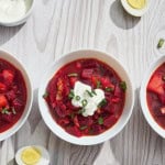 borsht soup in bowls with hardboiled eggs