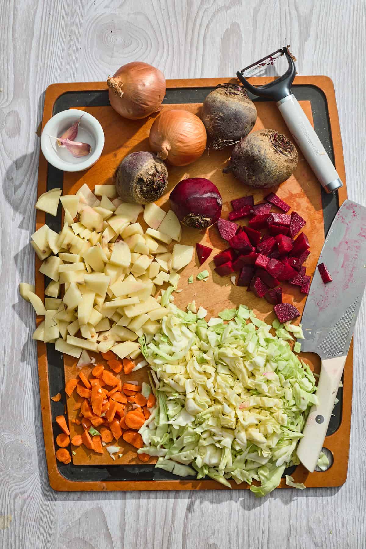 ingredients being chopped on a cutting board