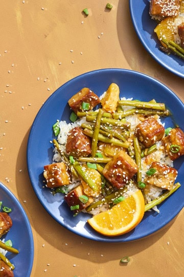 plates of asparagus and tempeh