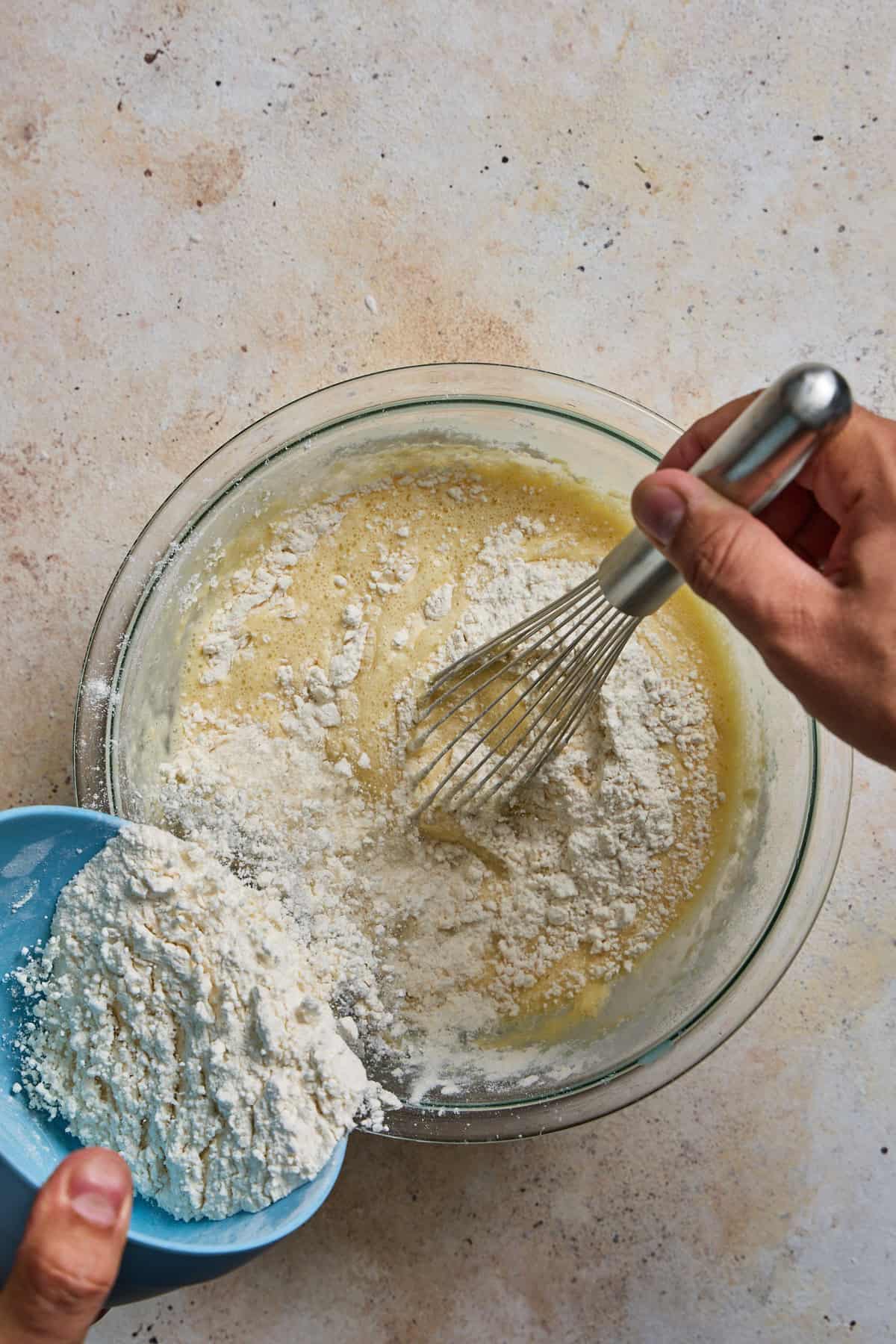 flour being whisked into the crepe batter