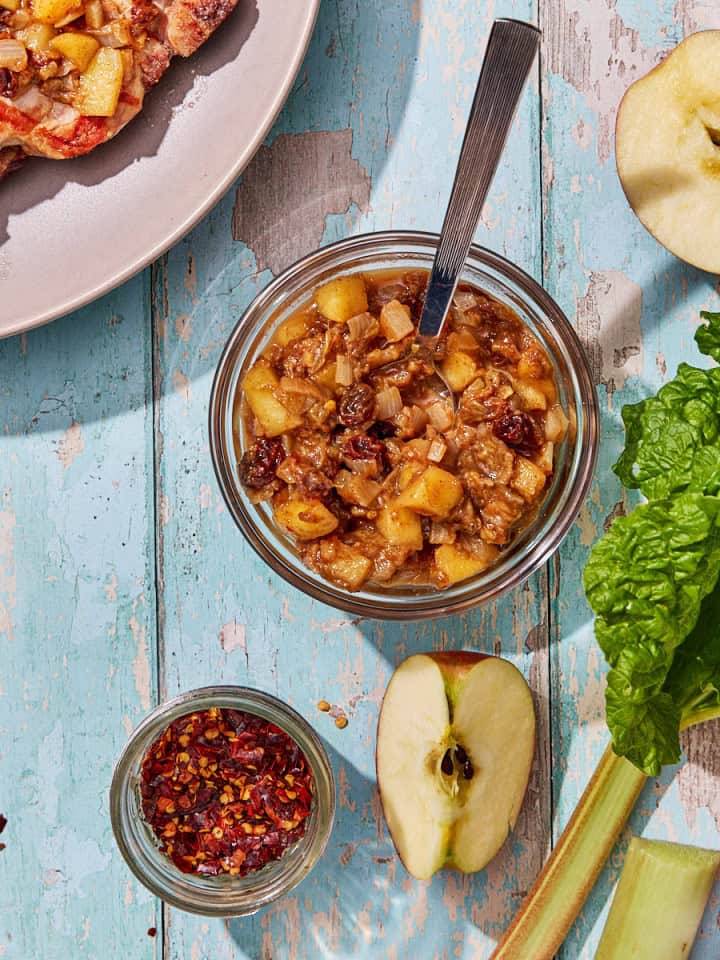 bowl of rhubarb chutney with apple slices