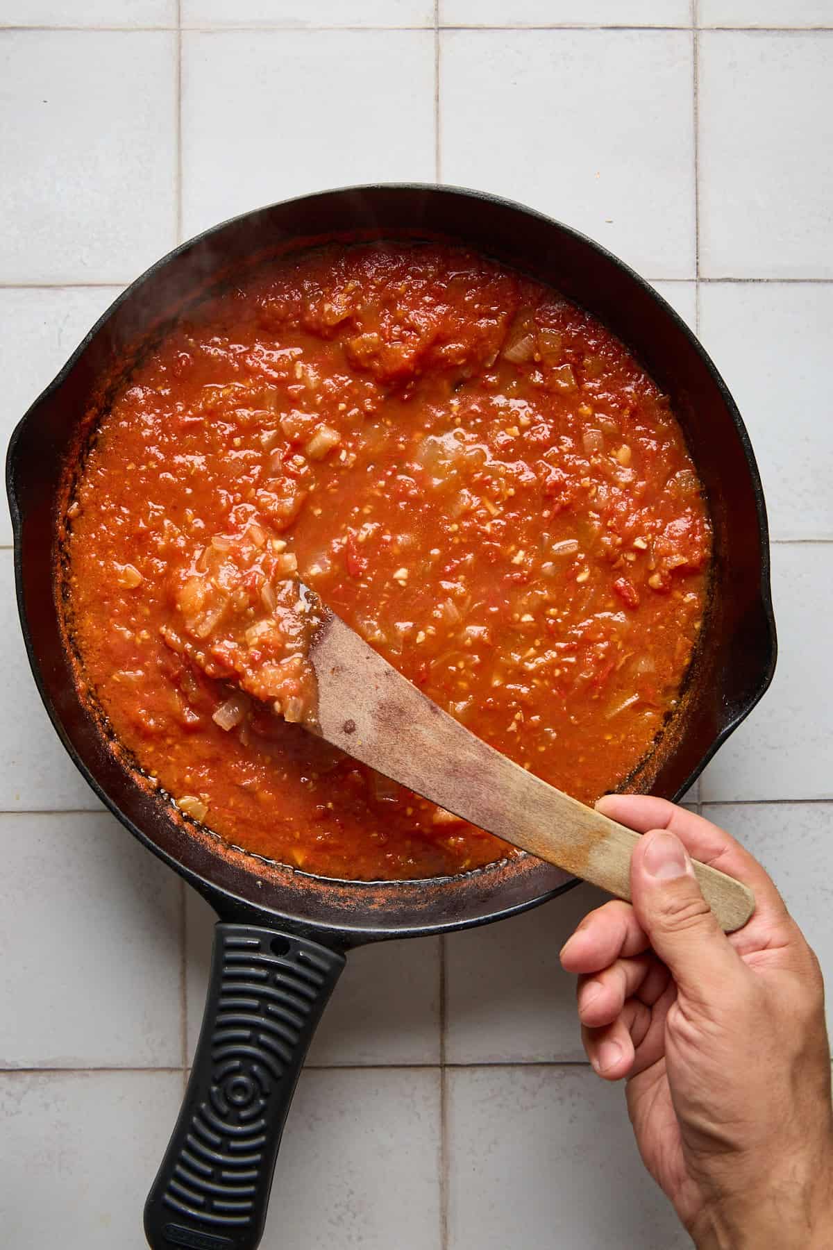 rum tomato sauce being reduced in a pan