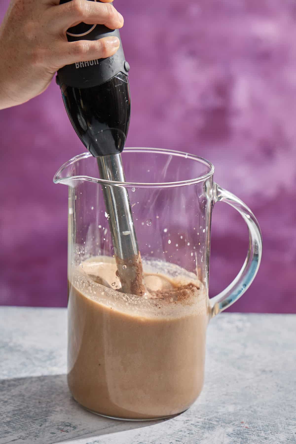 Irish cream being blended in a pitcher