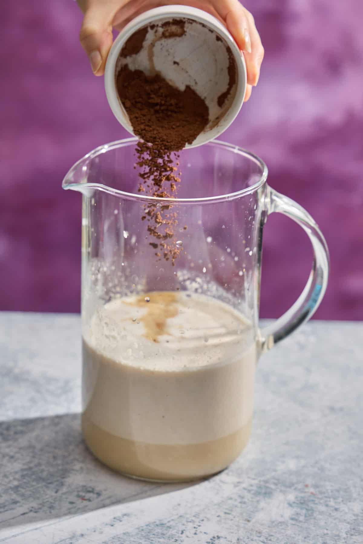 cocoa being added to irish cream pitcher