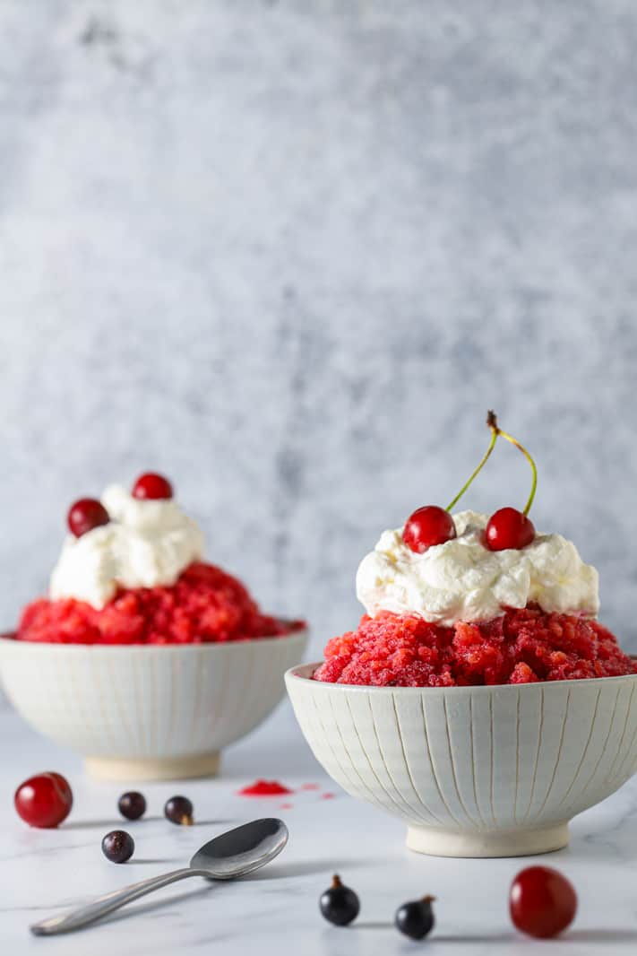 two bowls of granita with sherries and blackcurrants