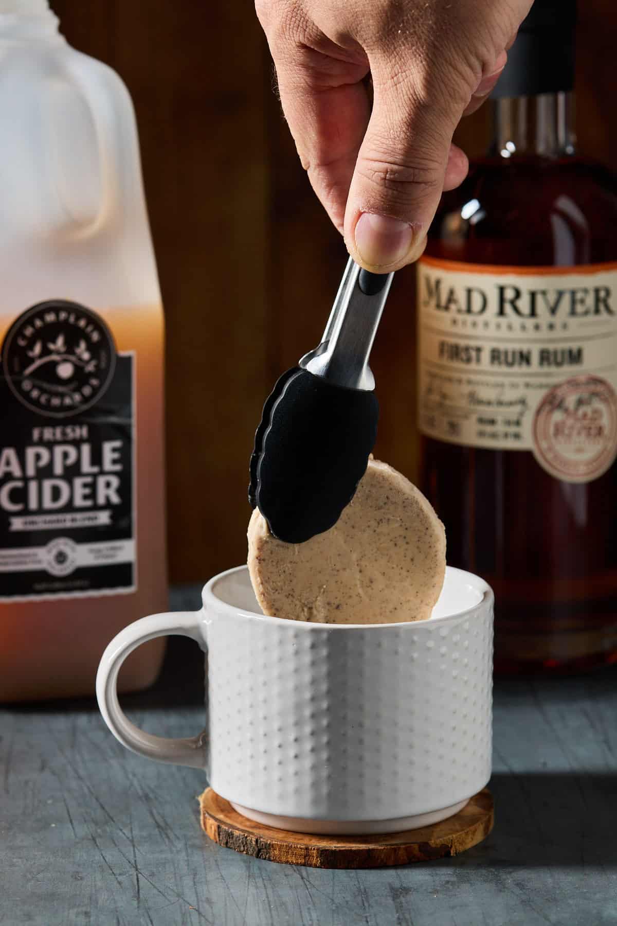 frozen hot buttered rum batter being added to a mug