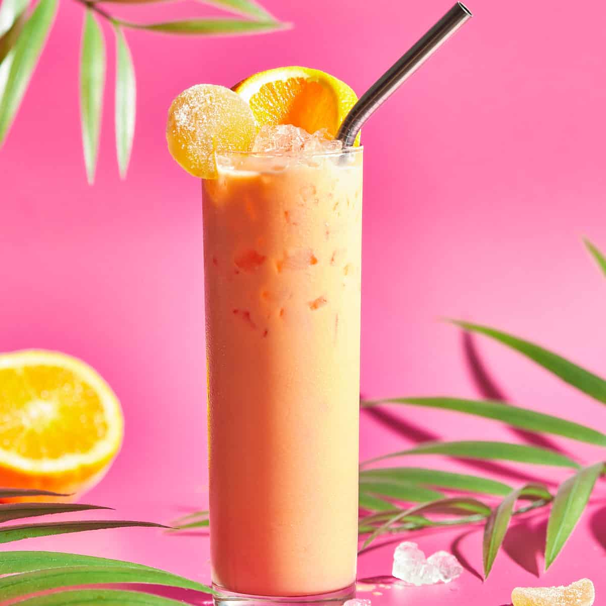 carrot drink in glass with straw