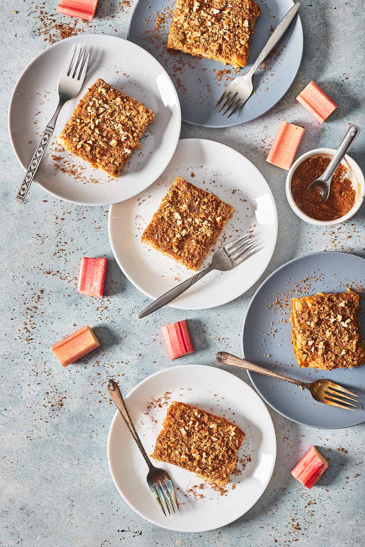rhubarb cake on plates with forks