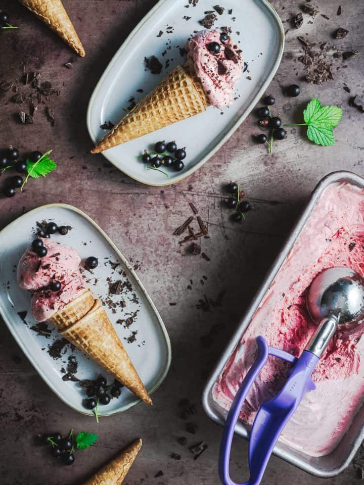 two cones of blackcurrant ice cream with chocolate