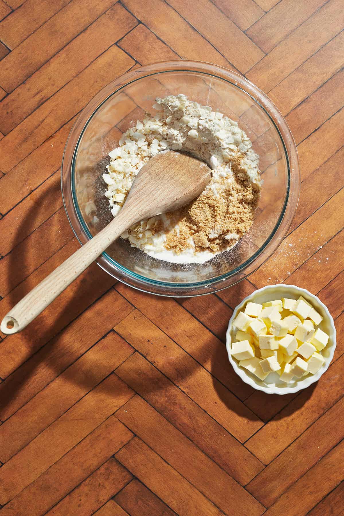 dry ingredients for the crisp in a bowl with the butter in a small bowl to the side