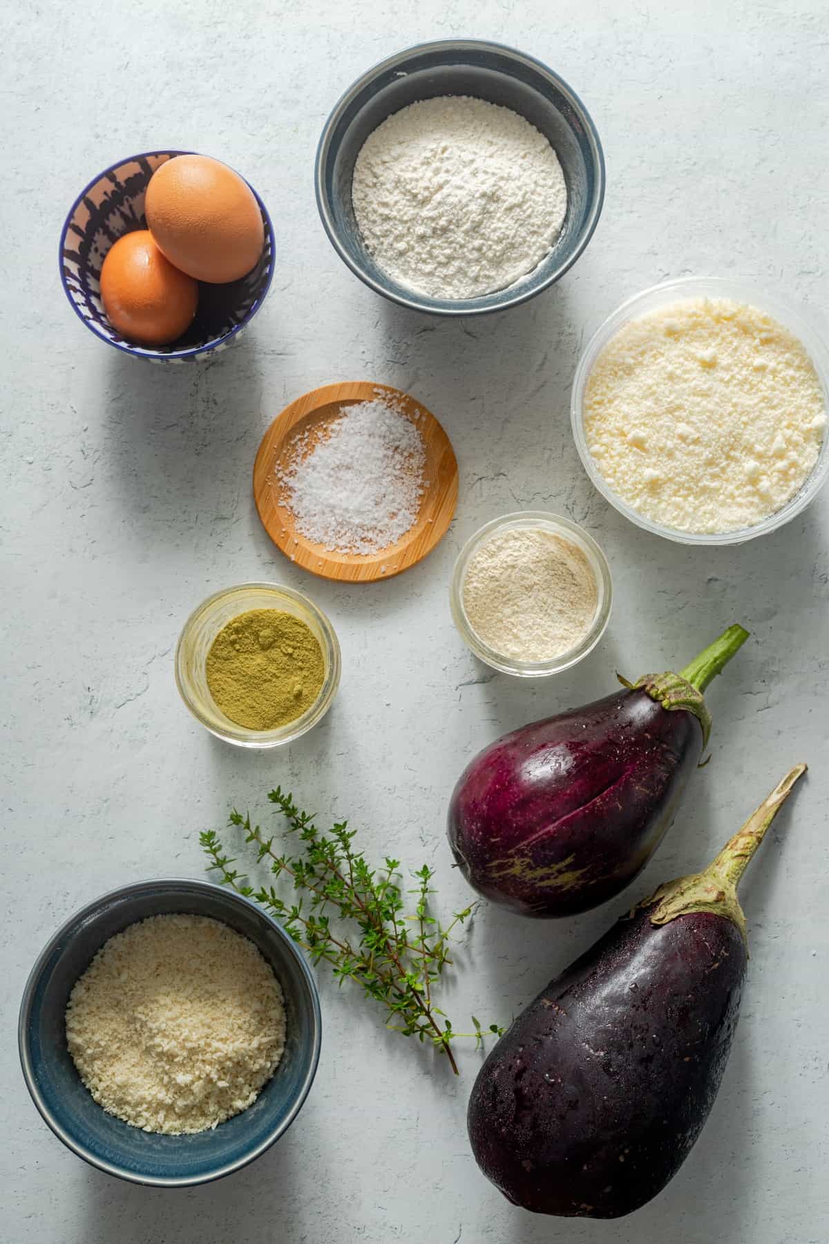 ingredients for eggplant fries laid out in bowls