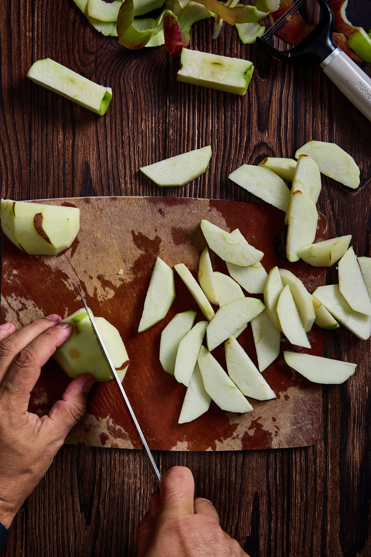 apples being peeled and sliced