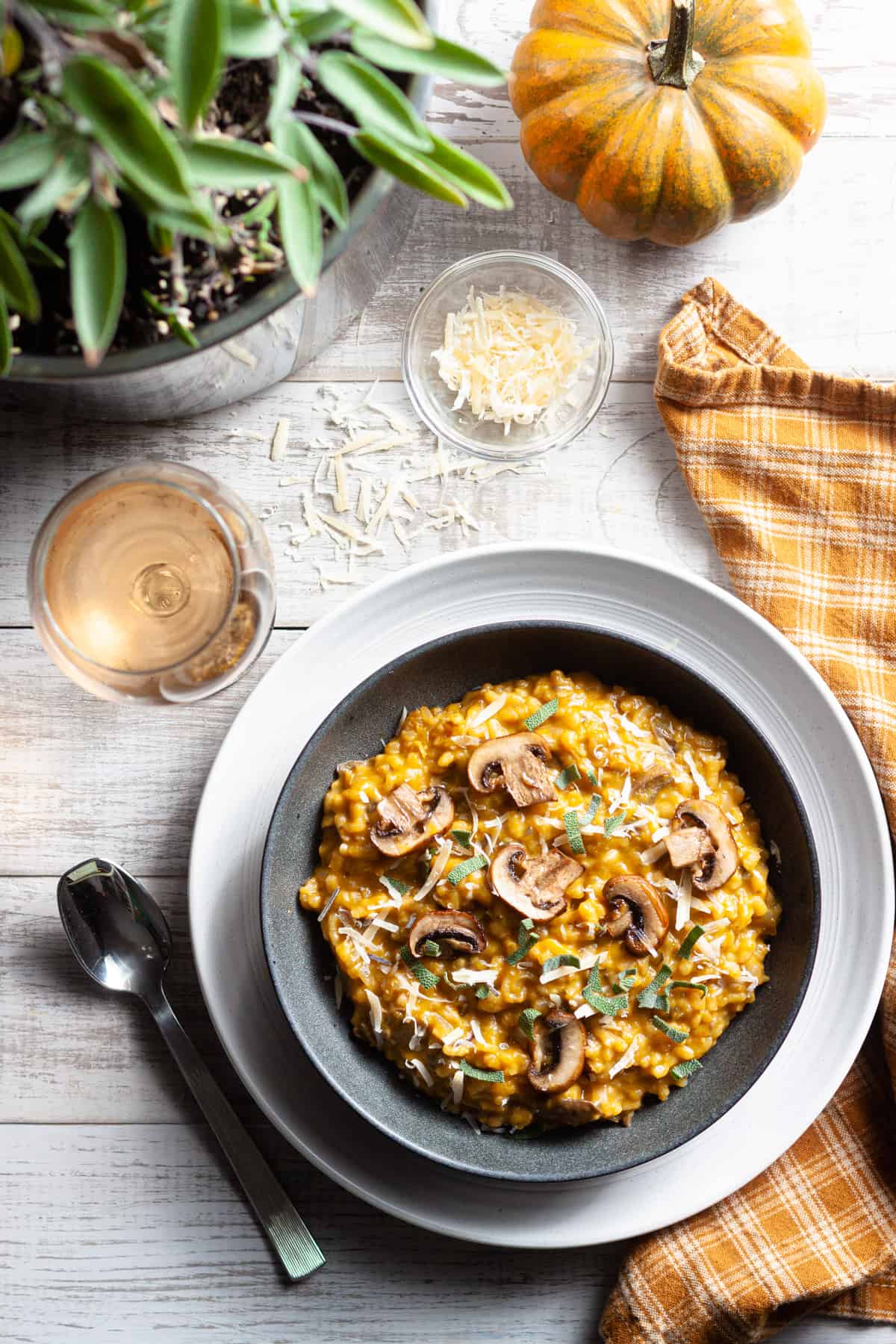 a bowl of mushroom and pumpkin risotto with sage and cheese