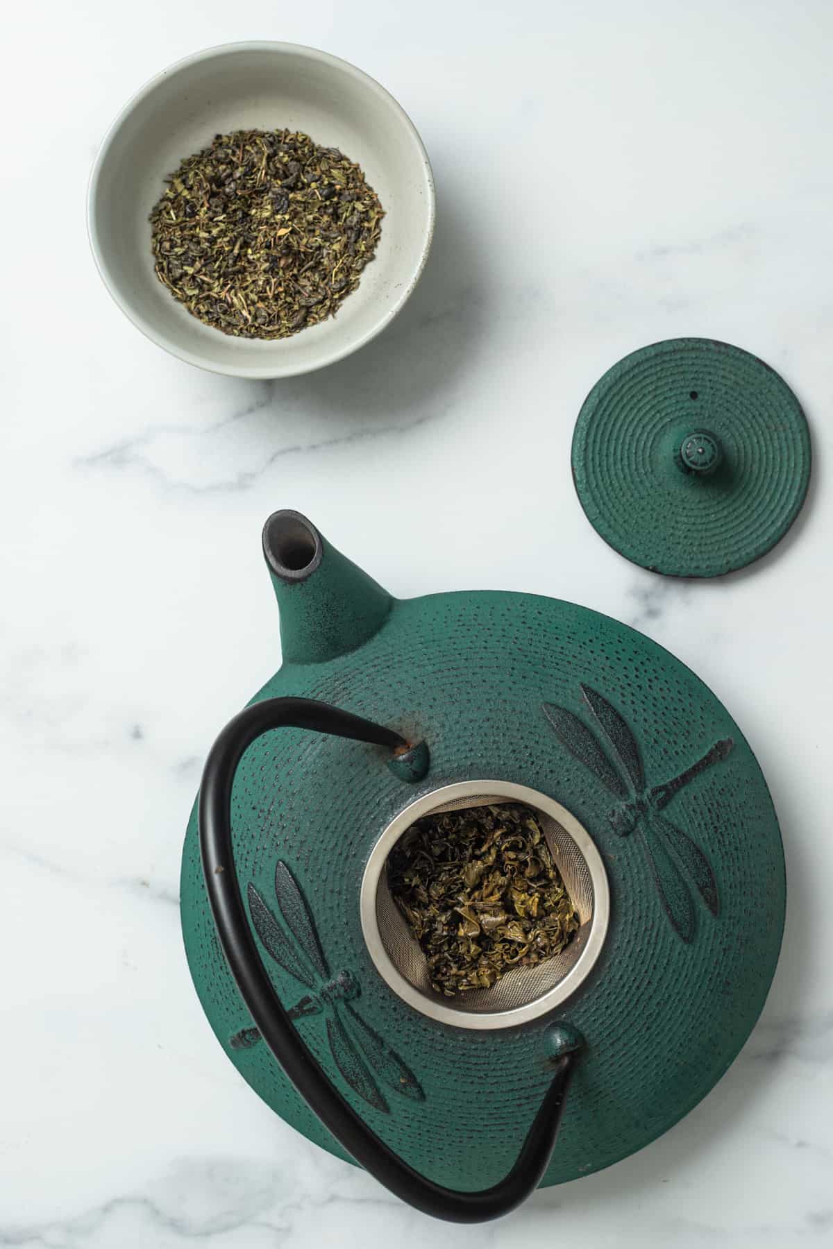 pot of tea with mint tea leaves