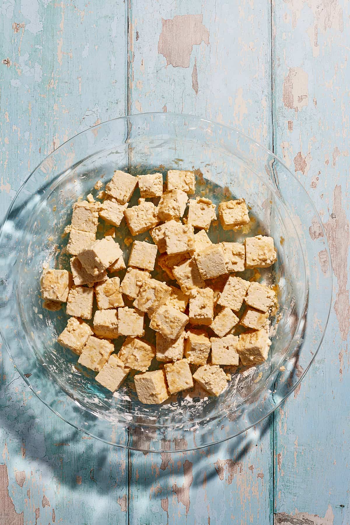 cubed tofu coated in cornstarch and ginger