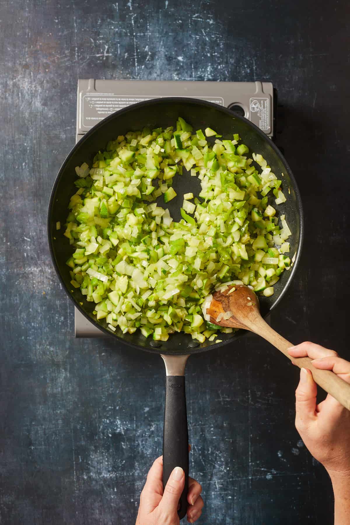 chopped vegetables cooking in a skillet