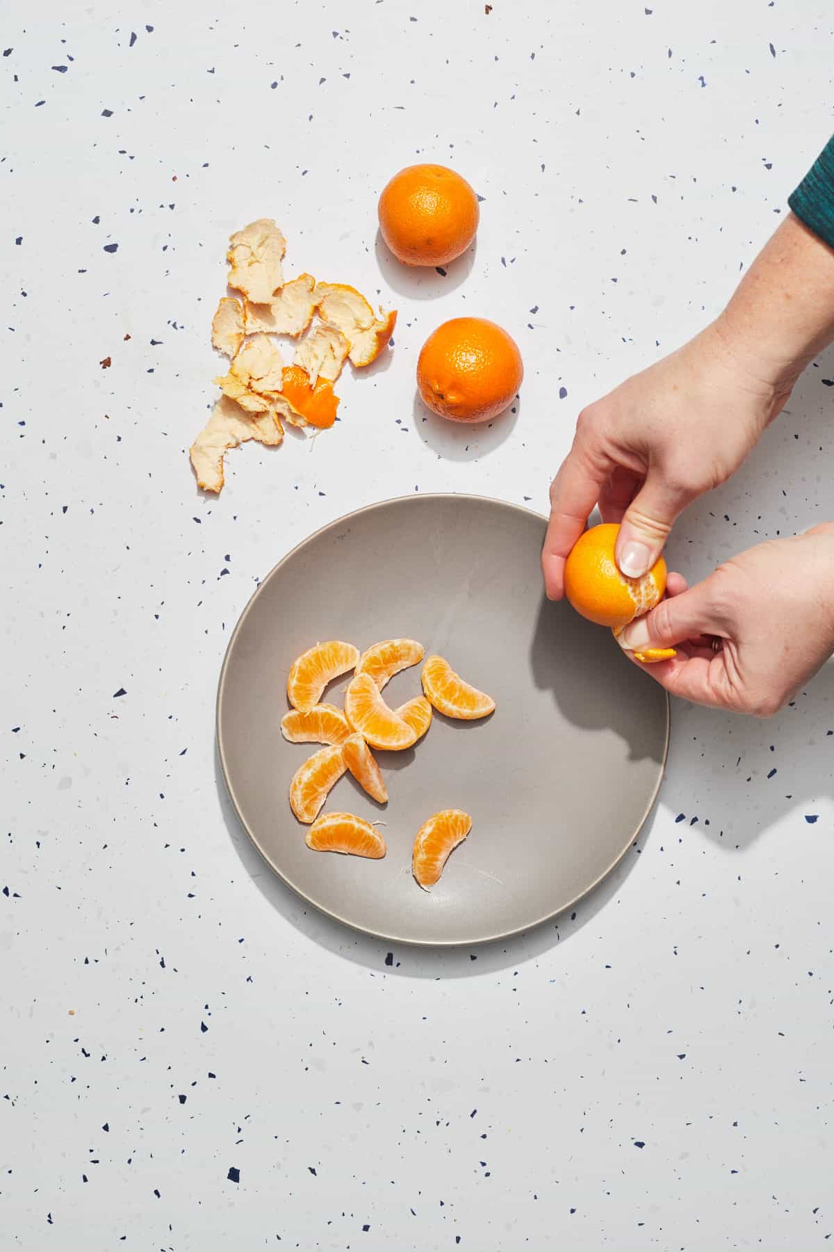 oranges being peeled