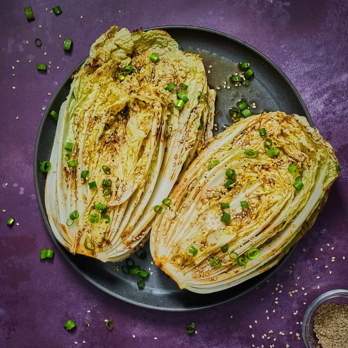 two napa cabbage halves with sesame seeds