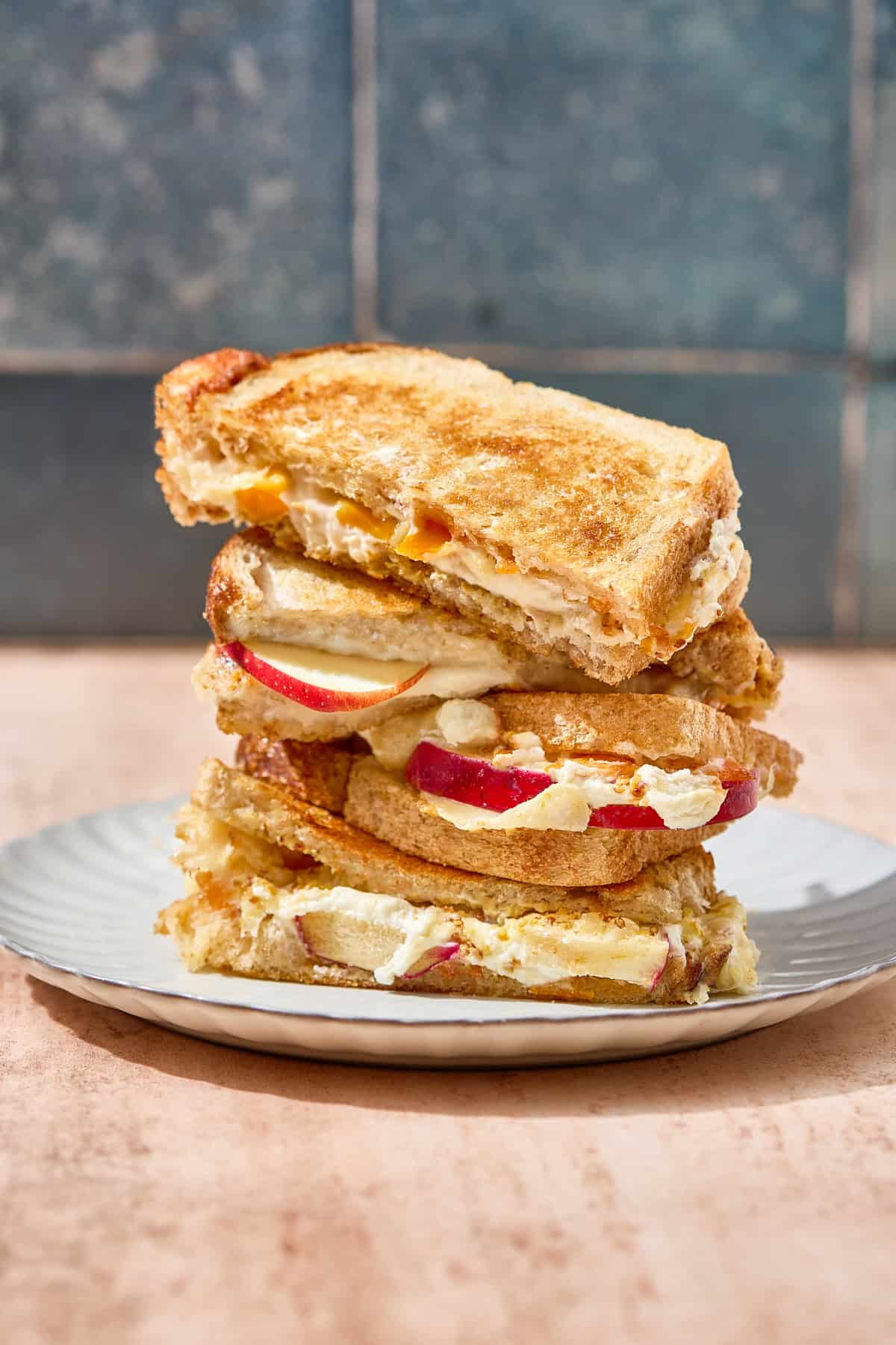 a stack of goat cheese grilled cheese sandwiches