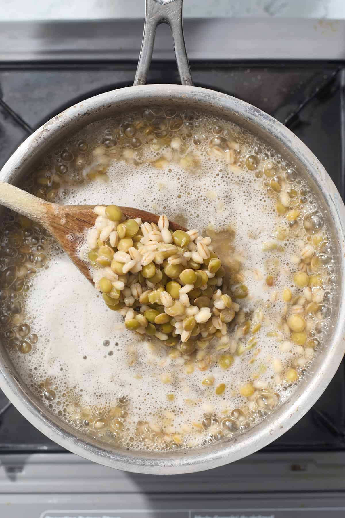 a pot of simmering lentils and barley