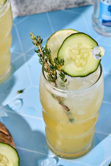 Easy and refreshing cucumber gin cocktail with fresh lime and thyme, perfect for summer entertaining.