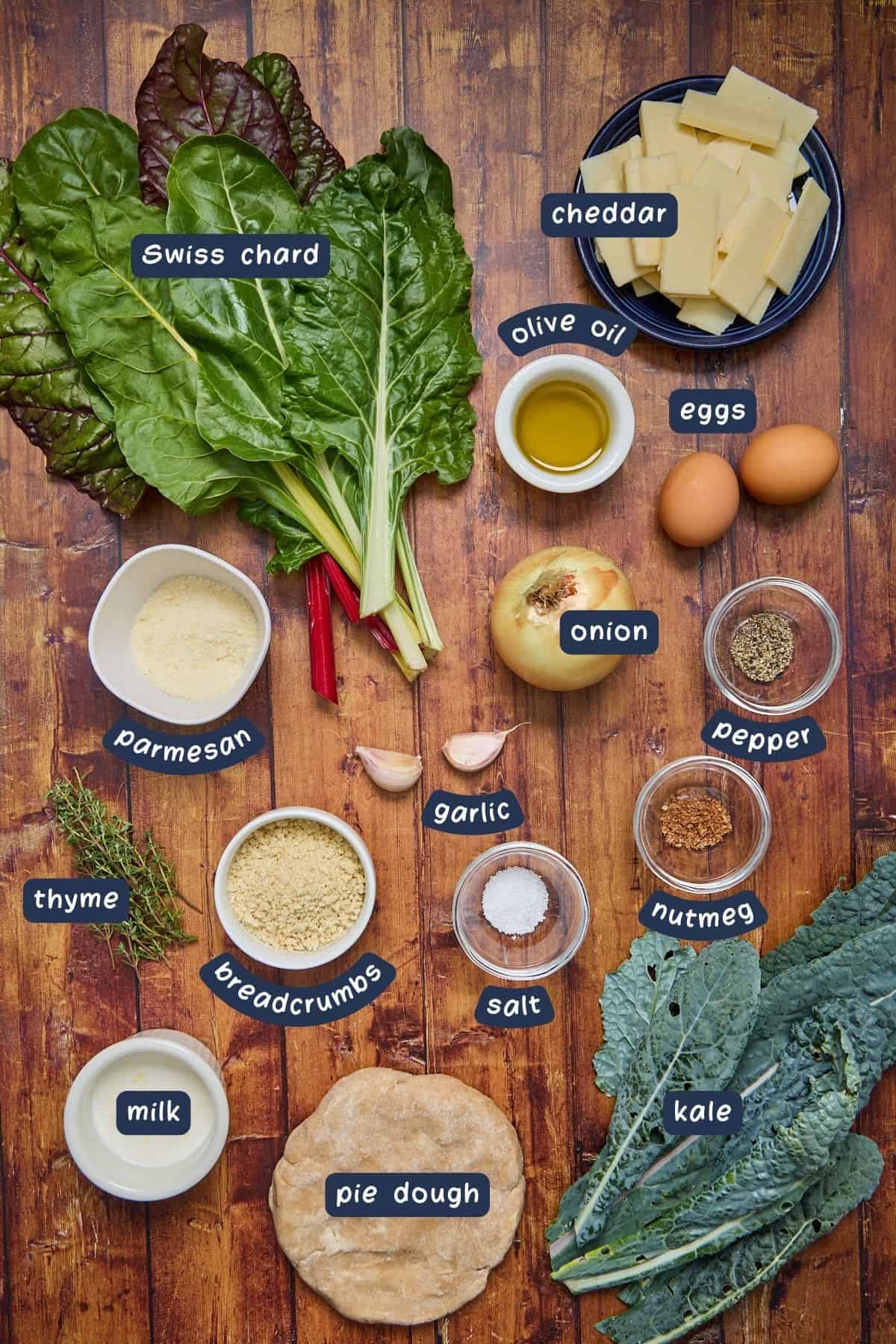 various ingredients for making the kale galette on a wooden table