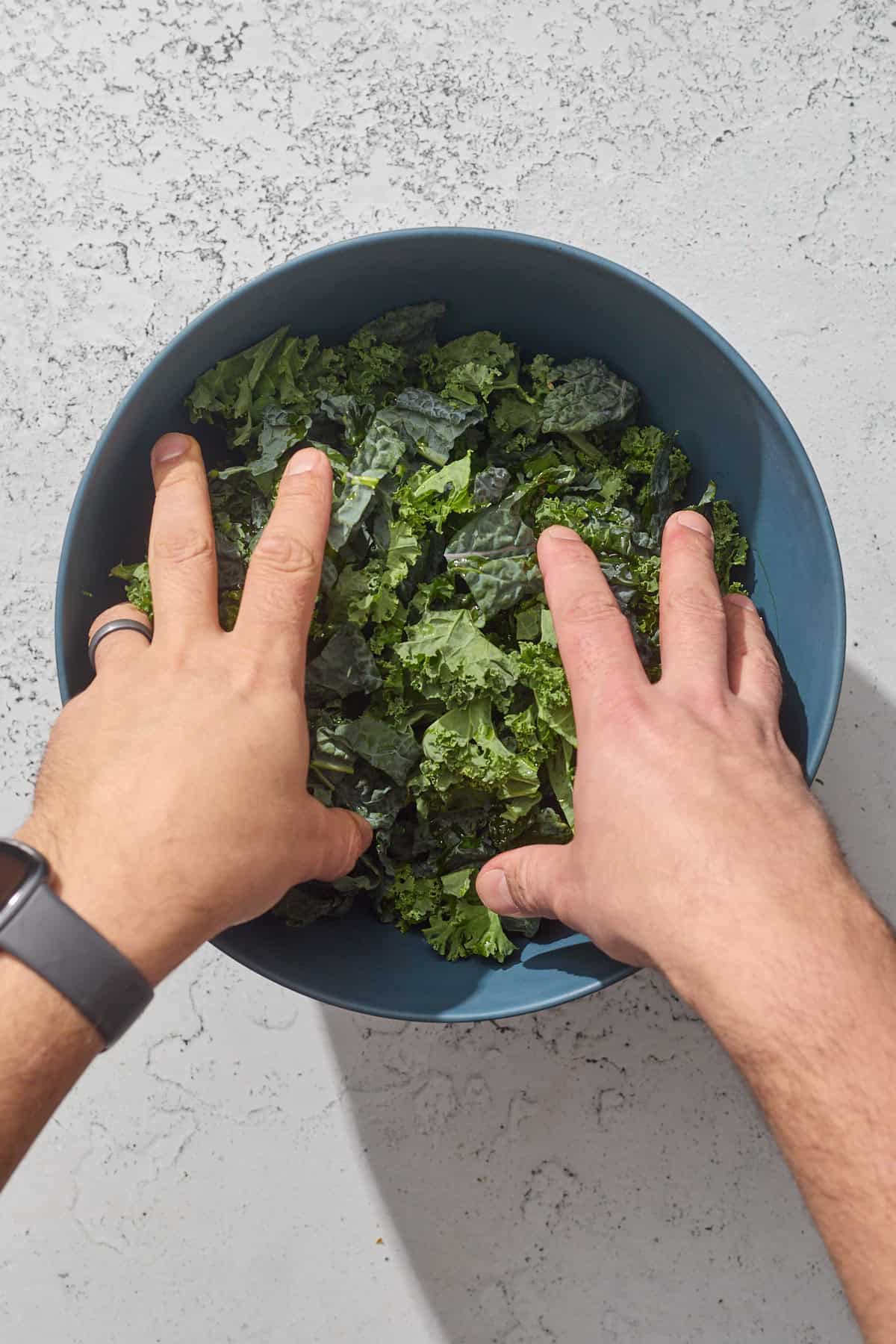 kale being massaged in a bowl