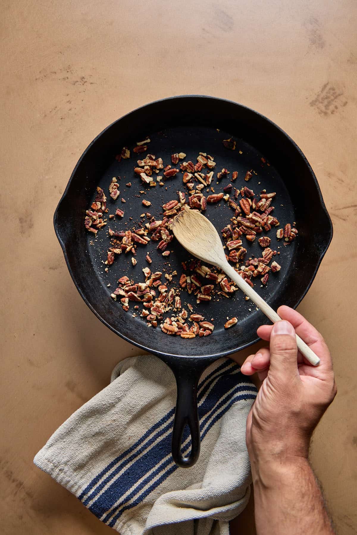 pecans toasting in a pan