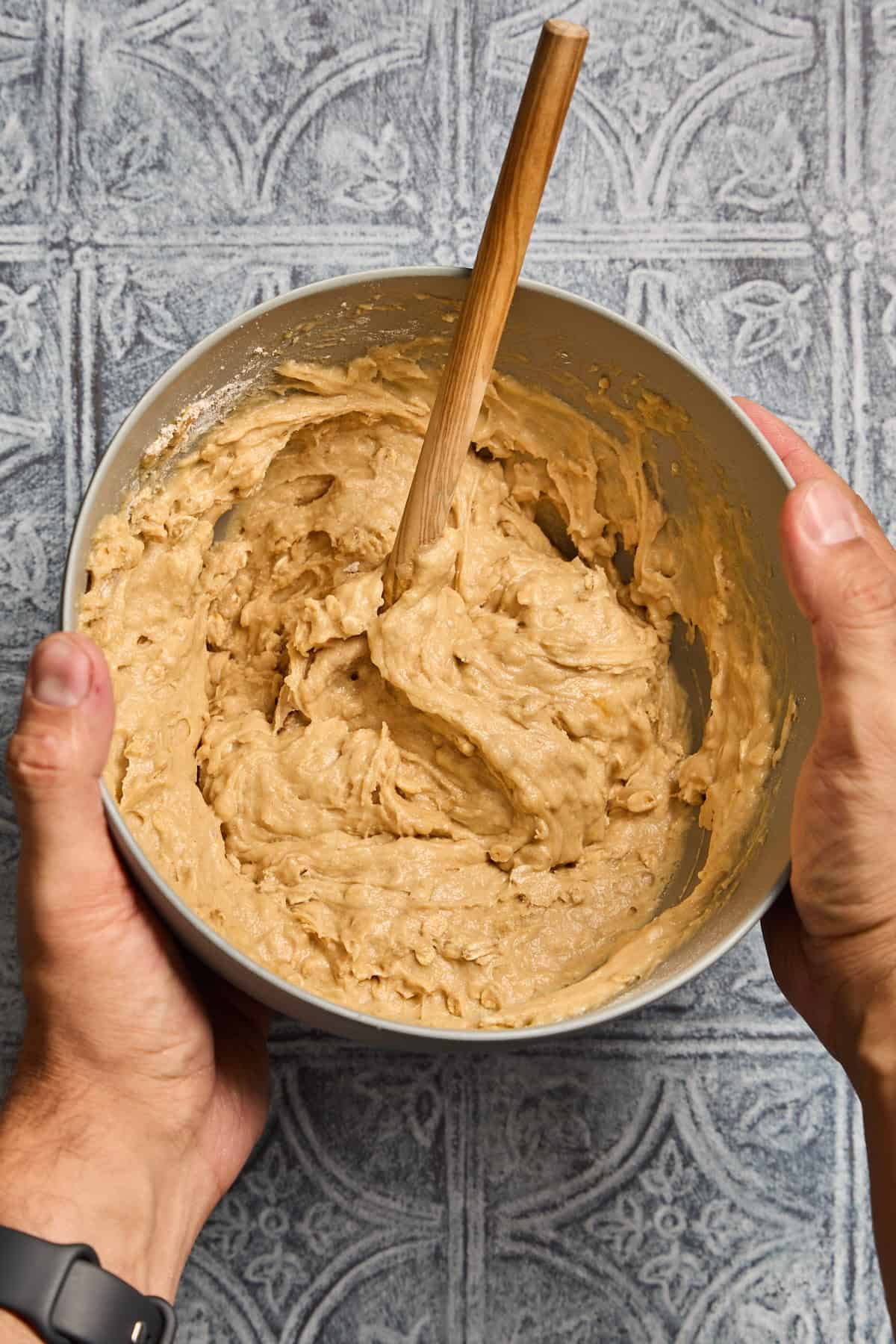 bowl of muffin batter with wooden spoon