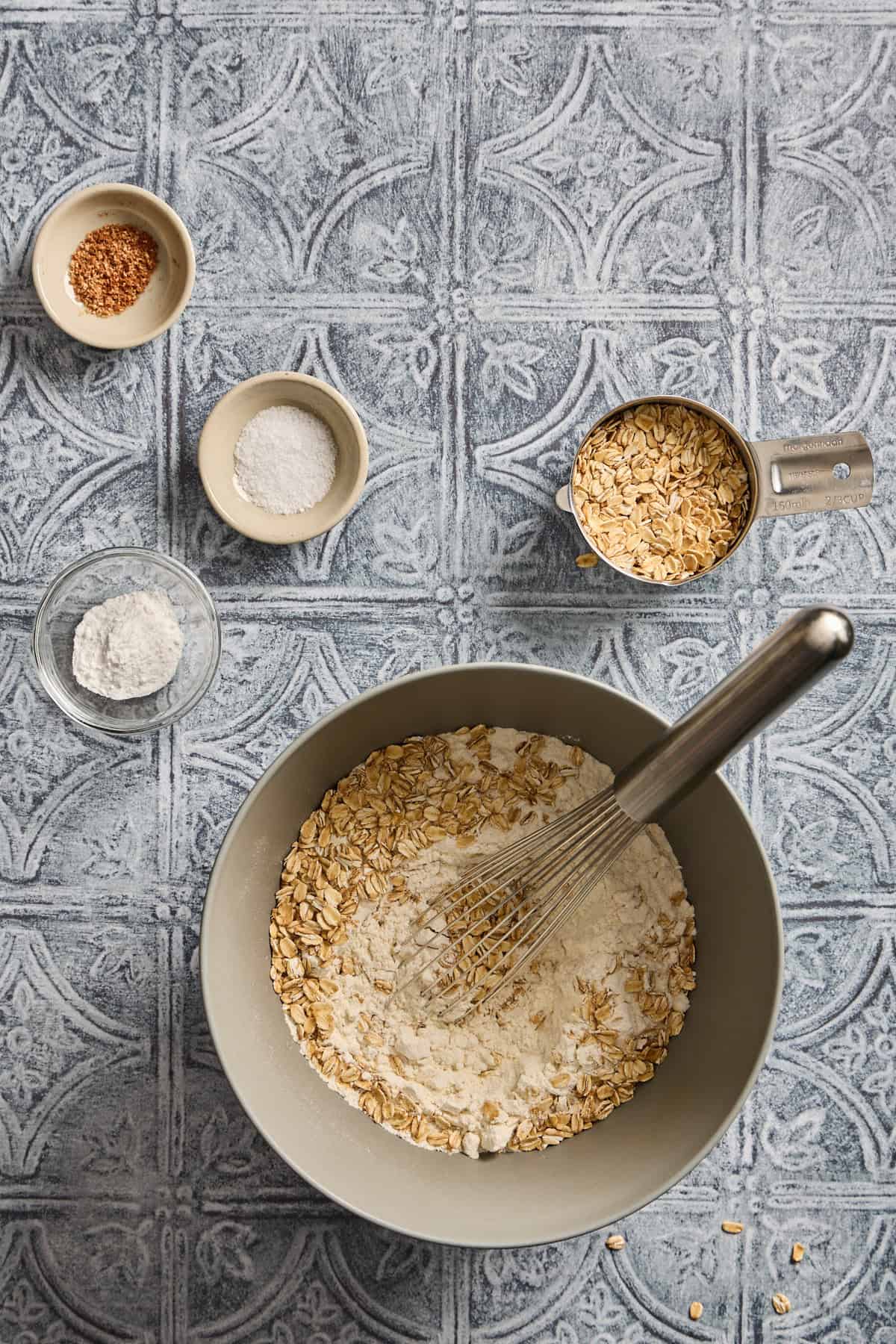 bowls of flour, oats, and sugar for making the muffins