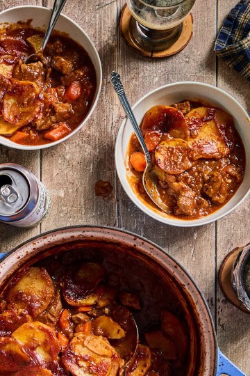 bowls and a pot of beef hot pot with stout beer