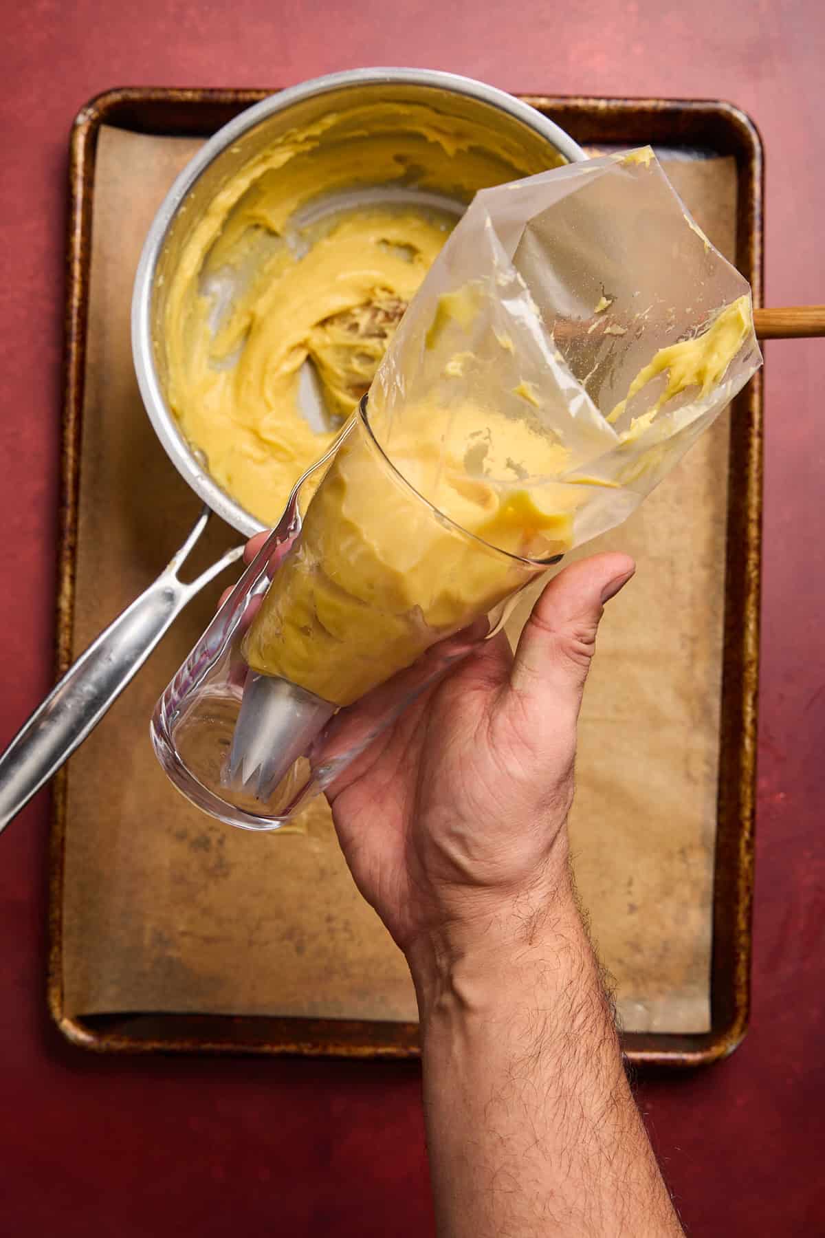 choux pastry dough in a piping bag