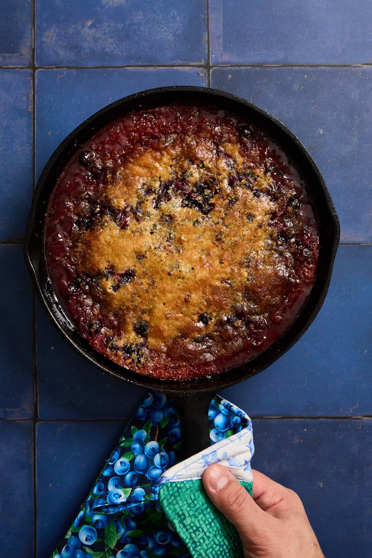 cake baked in a pan with a towel on the counter