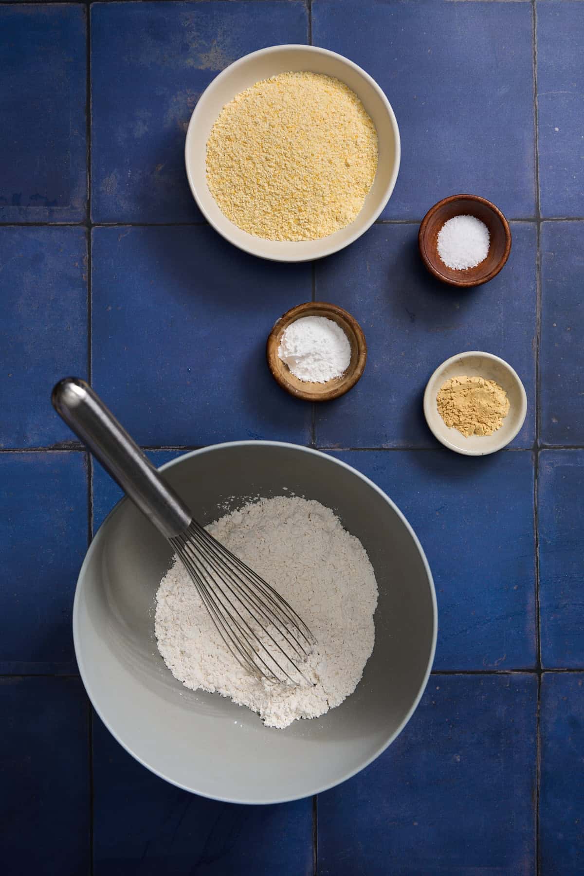 dry cake ingredients in bowls on counter