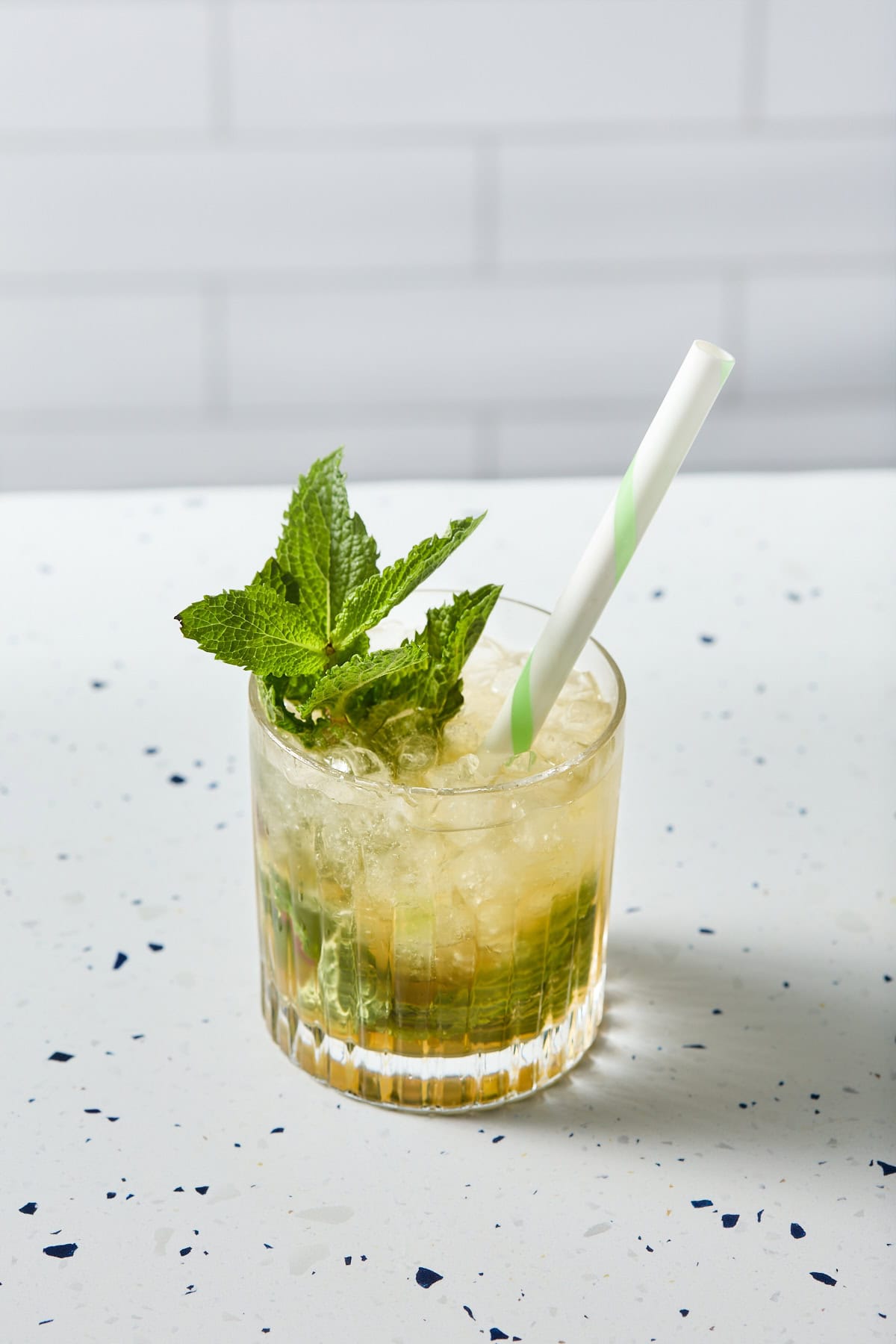 a glass of mint mocktail on a counter