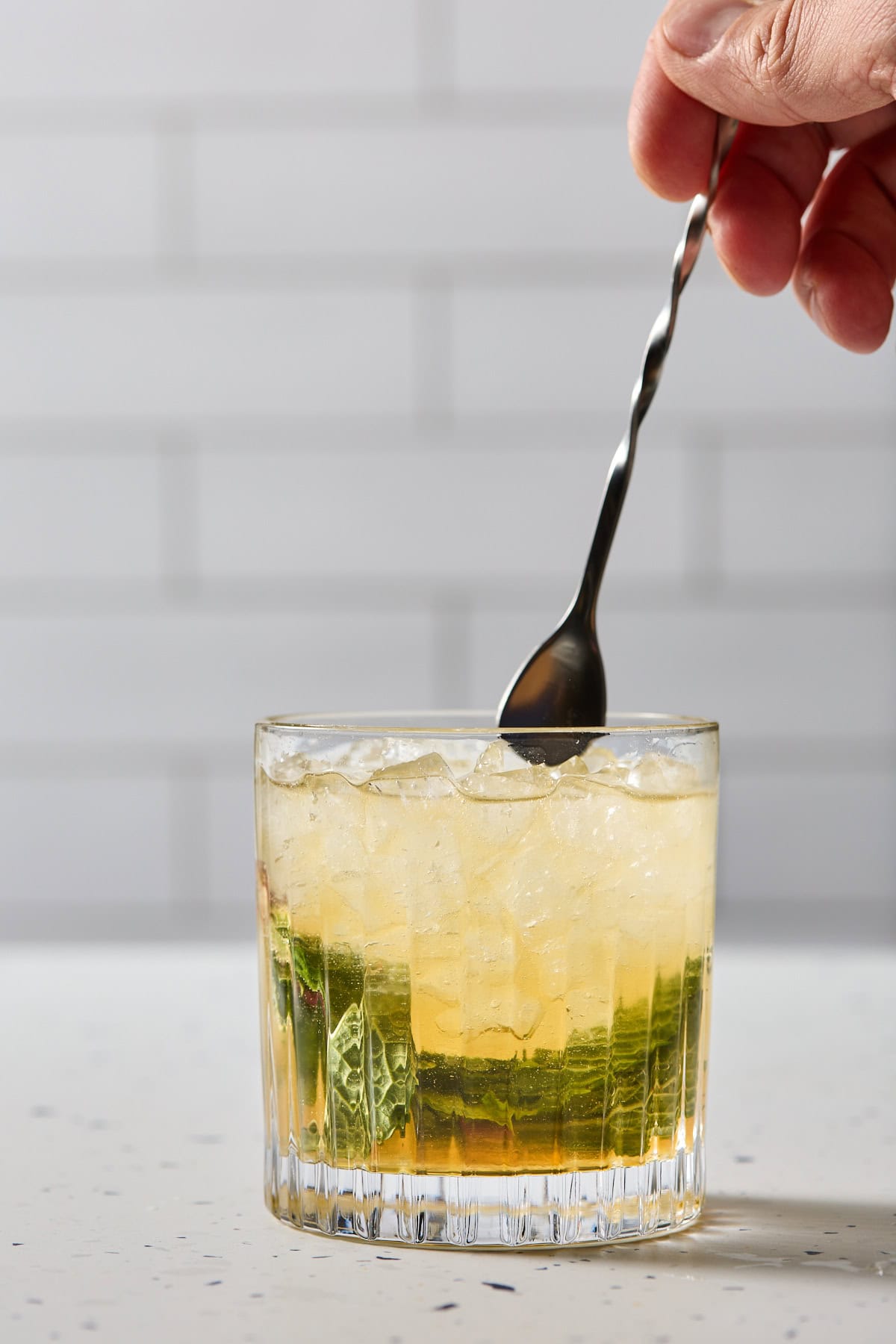 the mocktail being stirred