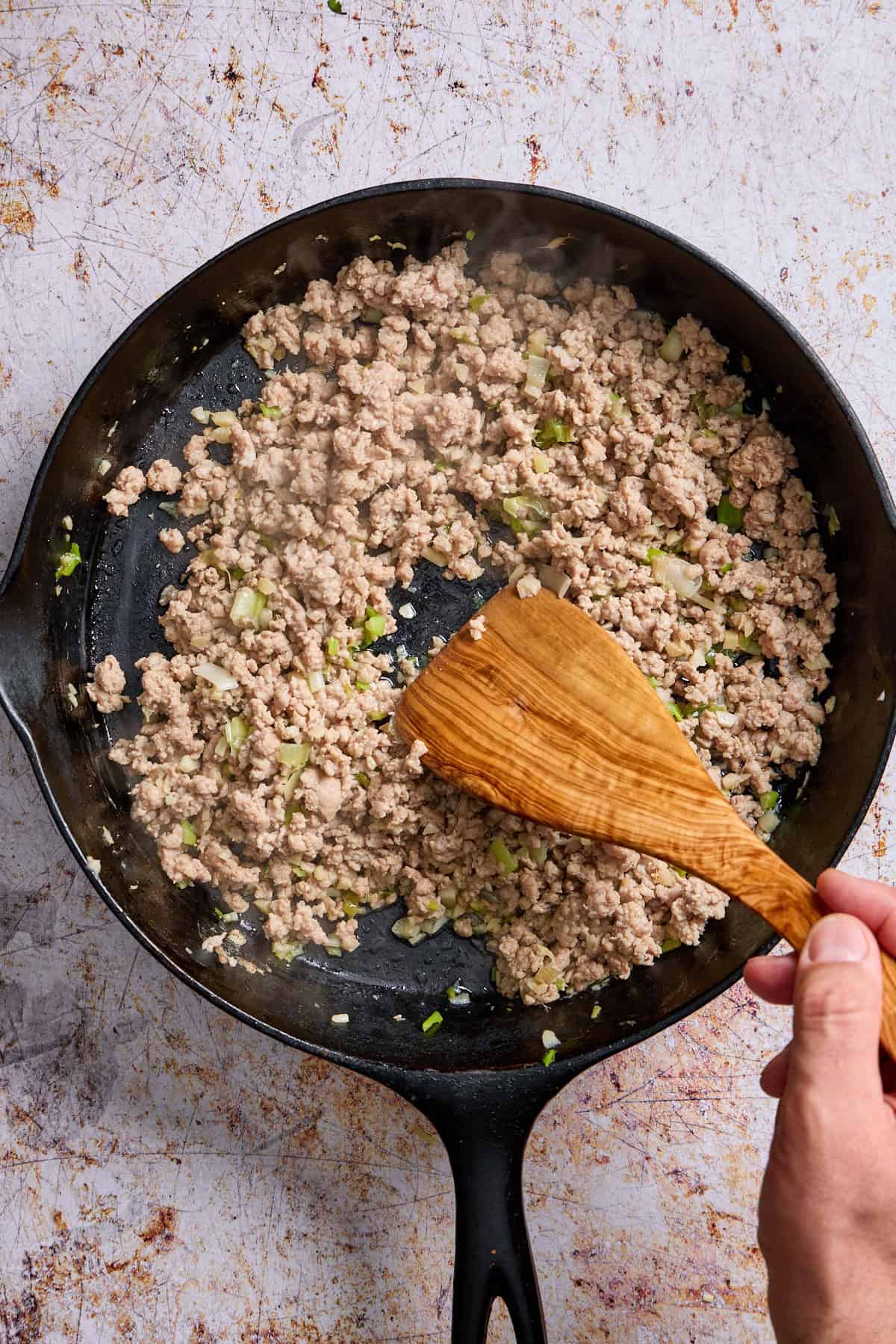 ground pork being browned in a pan