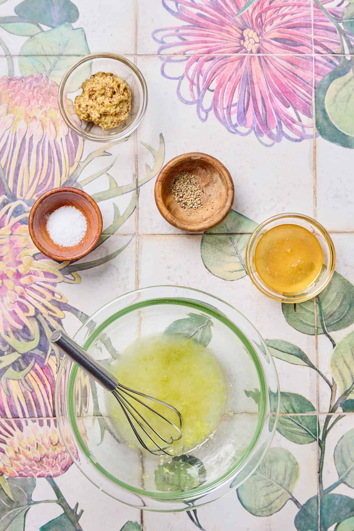 ingredients for the lemon sauce being whisked in a bowl