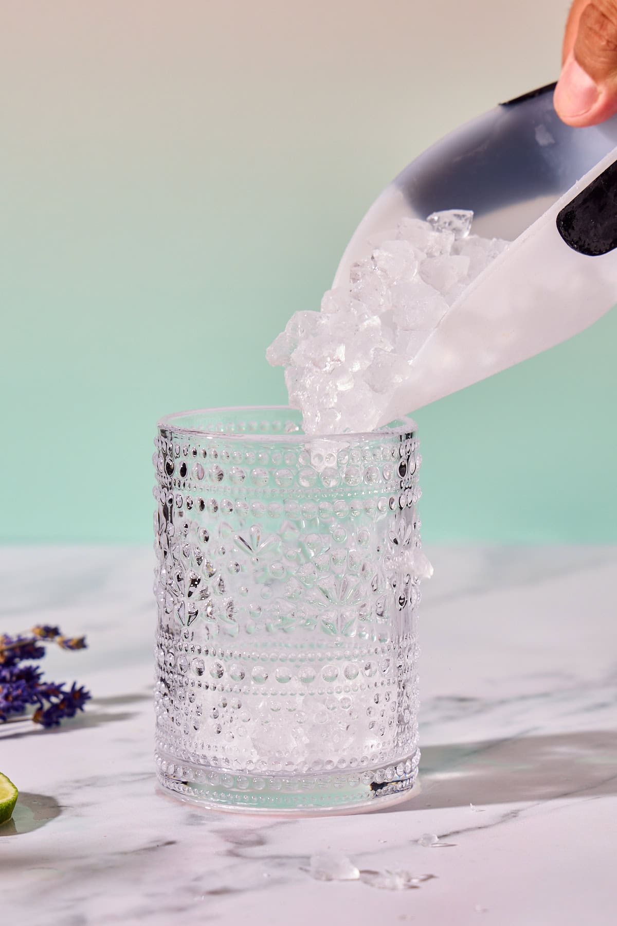 ice being poured into a glass