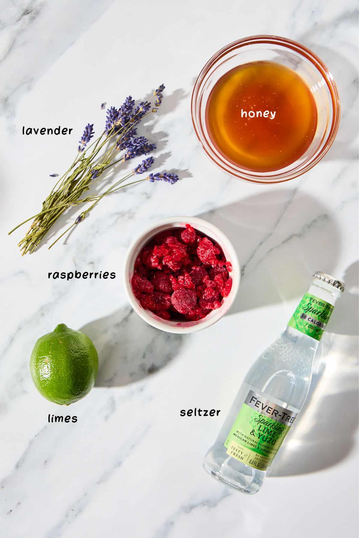 ingredients for making the mocktail on a marble counter